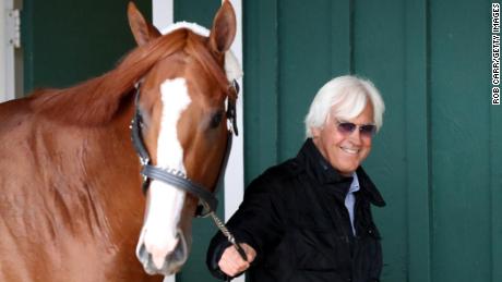 BALTIMORE, MD - MAY 16: Trainer Bob Baffert walks Kentucky Derby winner Justify in the barn after the horse arrived at Pimlico Race Course for the upcoming Preakness Stakes on May 16, 2018 in Baltimore, Maryland. (Photo by Rob Carr/Getty Images)