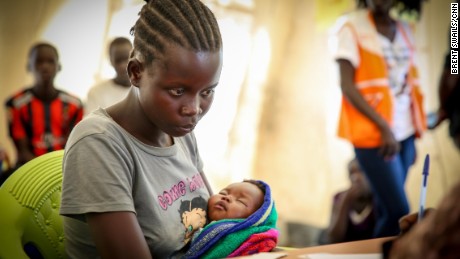 Blessing sits in a processing center, cradling her days-old infant hoping that one day she will be reunited with her parents. As a young mother with a baby daughter Blessing will receive special protection and services.