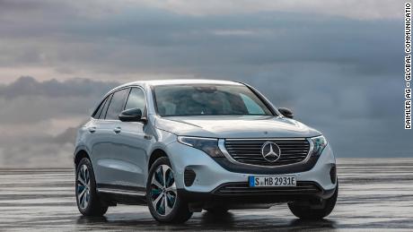 The Mercedes-Benz EQC is differentiated by a black band running under the grill and a bar of white light above it.