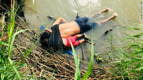 EDS NOTE: GRAPHIC CONTENT - The bodies of Salvadoran migrant Oscar Alberto Martínez Ramírez and his nearly 2-year-old daughter Valeria lie on the bank of the Rio Grande in Matamoros, Mexico, Monday, June 24, 2019, after they drowned trying to cross the river to Brownsville, Texas. Martinez&#39; wife, Tania told Mexican authorities she watched her husband and child disappear in the strong current. (AP Photo/Julia Le Duc)