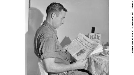 October 1950:  American steelworker Charlie Grapentine reading about the Korean War in the Youngstown Vindicator. He earns 320 dollars per month for a 40 hour week at the United States Steel Corporation works in Youngstown, Ohio. His salary supports his wife Josephine and their children Charles and Nancy.  (Photo by Doreen Spooner/Keystone Features/Getty Images)