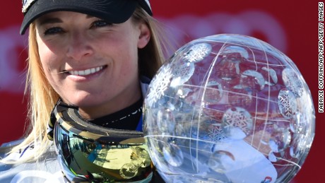 Switzerland&#39;s Lara Gut holds the Ladies&#39; crystal globe trophy on the podium of the FIS Alpine Skiing World Cup in St Moritz on March 20, 2016.  AFP PHOTO / FABRICE COFFRINI / AFP / FABRICE COFFRINI        (Photo credit should read FABRICE COFFRINI/AFP/Getty Images)