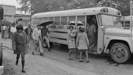 Black students in Woodville, Mississippi board a school bus for their first day at a formerly white school that, thanks to &quot;white flight&quot;, has become all black. The school, in Wilkinson County, is one of thirty Mississippi school districts under court orders to speed desegregation.