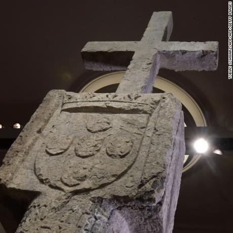 A picture taken on May 17, 2019 in Berlin shows a Stone Cross, a key 15th-century navigation landmark erected by Portuguese explorers, seen at the History Museum in Berlin. - The History Museum museum announced it would restitute the cross to Namibia as part of Berlin&#39;s efforts to face up to its colonial past. Placed in 1486 on the western coast of what is today Namibia, the Stone Cross was once considered to be such an important navigation marker that it featured on old world maps. In the 1890s, it was removed from its spot on Cape Cross and brought to Europe by the region&#39;s then German colonial masters. (Photo by Tobias SCHWARZ / AFP)        (Photo credit should read TOBIAS SCHWARZ/AFP/Getty Images)