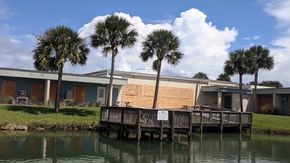 Plywood covers windows at the University of Florida’s Whitney Laboratory for Marine Bioscience in St. Augustine.