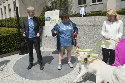 Ambassador of Sweden to the United States Björn Lyrvall,  Under Secretary of State for Economic Growth, Energy, and the Environment Catherine Novelli, and  Ambassador-at-Large for Global Women's Issues Catherine Russell are joined by Secretary Kerry's dog Ben during a ribbon-cutting ceremony at the U.S. Department of State's fifth Annual 6k Walk for Water.