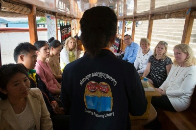 Dr. Jill Biden visits a book boat that brings hundreds of books to children in more than 75 remote riverside villages on the Mekong River and is supported by the U.S. Embassy, in Luang Prabang, Laos. Also pictured are EAP Principal Dep. Assistant Secretary Scot Marciel, USAID Sr. Advisor for International Education Christie Vilsack, Chief of Staff to Dr. Biden Sheila Nix, and Amb. Russell.