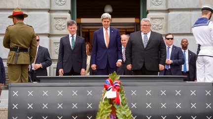 Secretary Kerry, flanked by New Zealand Attorney-General Christopher Finlayson and Defense Secretary Gerry Brownlee, pauses for a moment of silence after laying a frond at the Tomb of the Unknown Warrior at the Pukeahu National War Memorial Park at Anzac Square in Wellington, New Zealand.