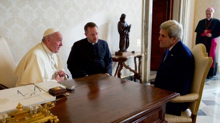 Secretary Kerry sits with Pope Francis and his translator on December 2, 2016, before a one-on-one meeting in the Papal Apartments at the Vatican in Vatican City.