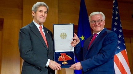 Secretary of State John Kerry poses with German Foreign Minister Frank-Walter Steinmeier after receiving the Order of Merit - the higher civilian award in Germany - from German officials during a ceremony at the German Foreign Ministry.