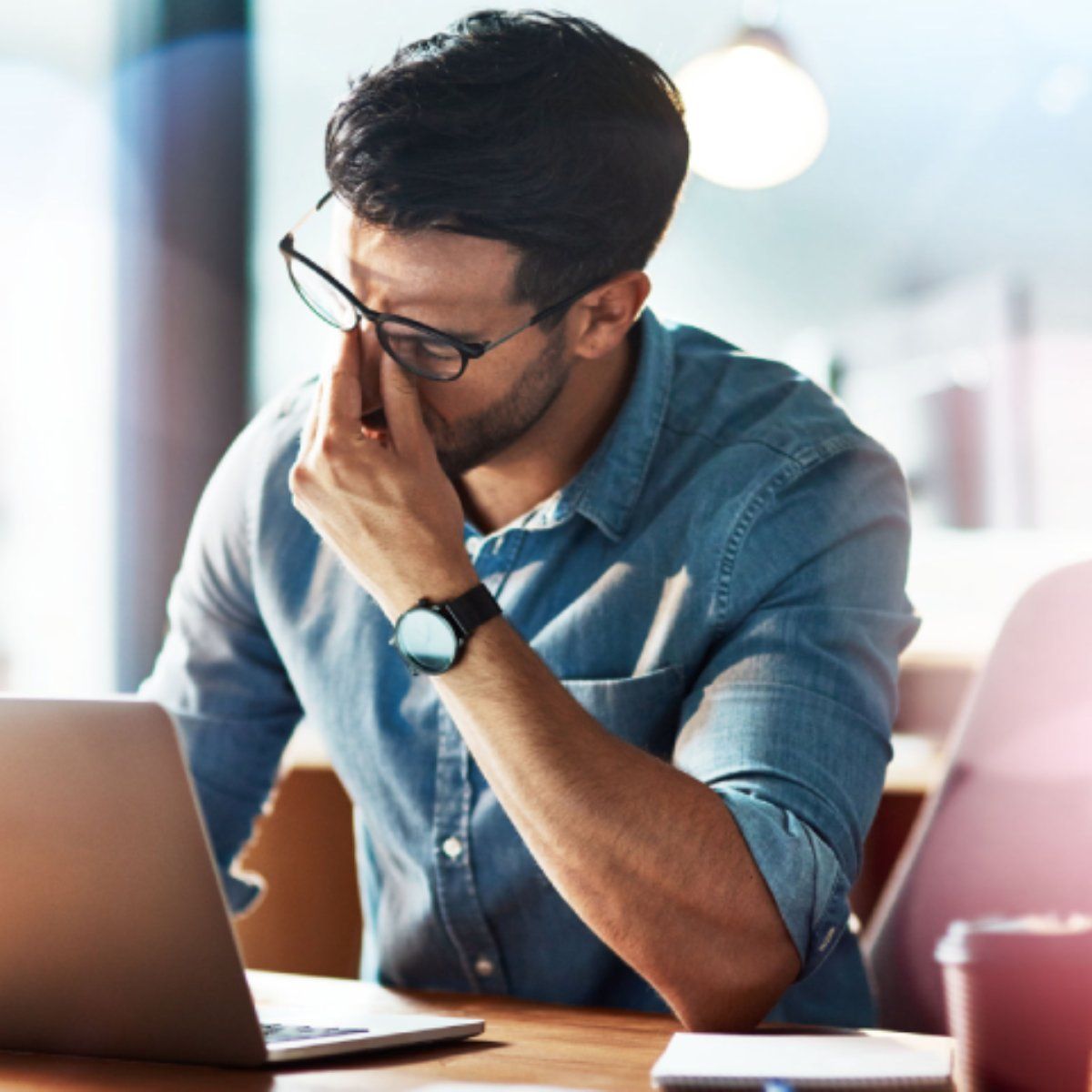 Man looking frustrated at computer