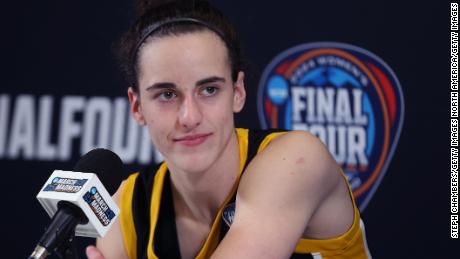 CLEVELAND, OHIO - APRIL 07: Caitlin Clark #22 of the Iowa Hawkeyes talks with the media after losing to the South Carolina Gamecocks in the 2024 NCAA Women&#39;s Basketball Tournament National Championship at Rocket Mortgage FieldHouse on April 07, 2024 in Cleveland, Ohio. South Carolina beat Iowa 87-75. (Photo by Steph Chambers/Getty Images)