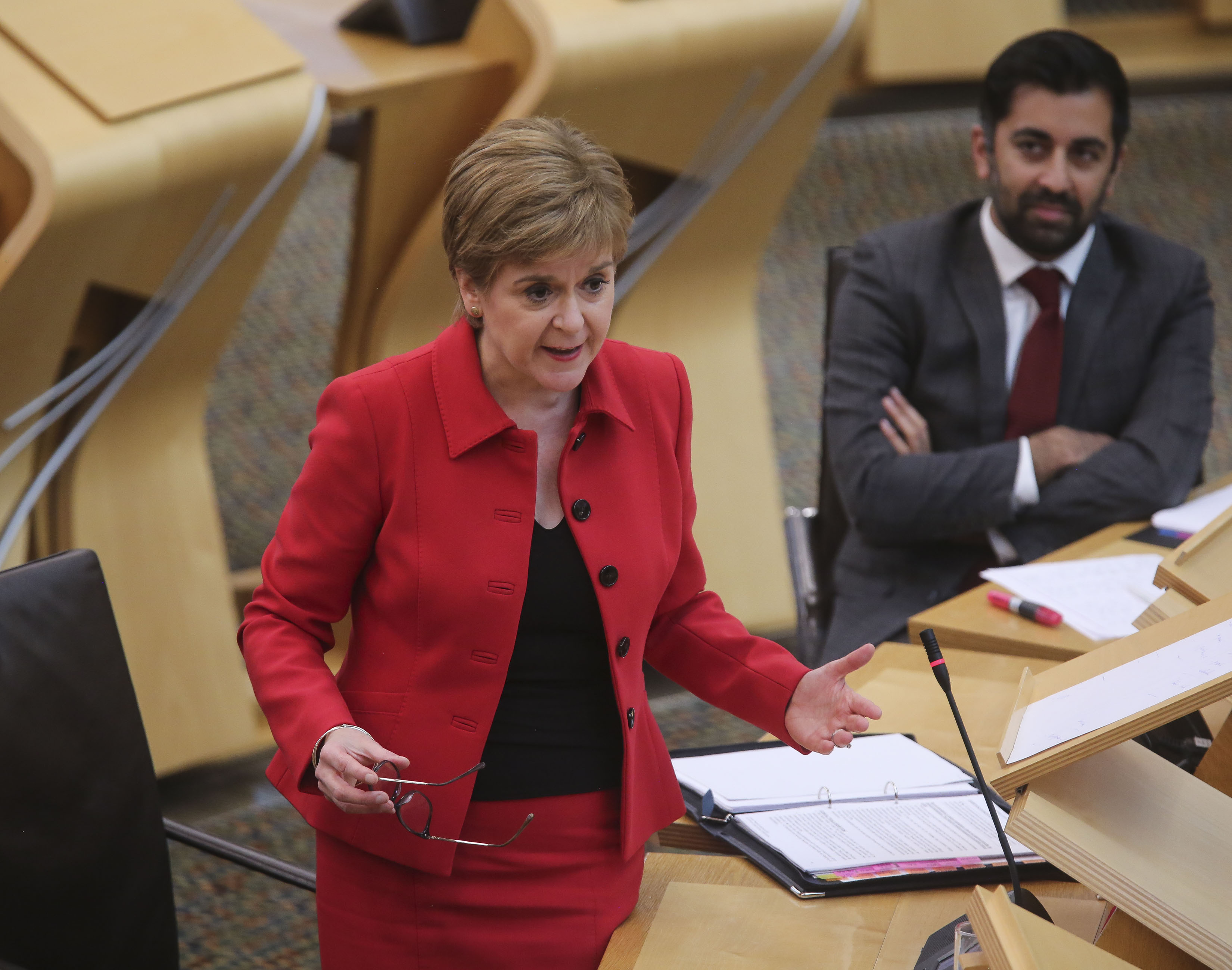 Nicola Sturgeon speaking as Humza Yousaf watches on