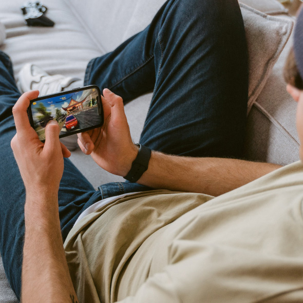 Person playing a game on their smartphone