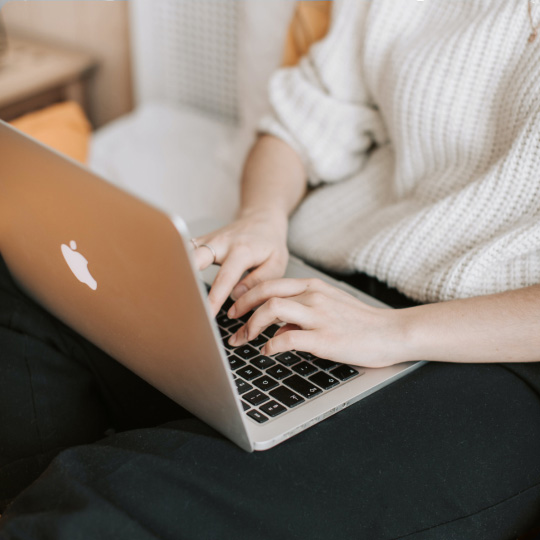 Person typing on a laptop