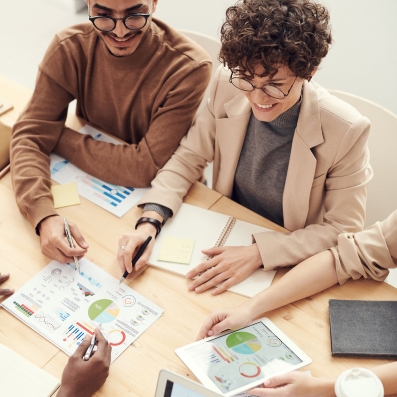 People sitting at a table looking at results.