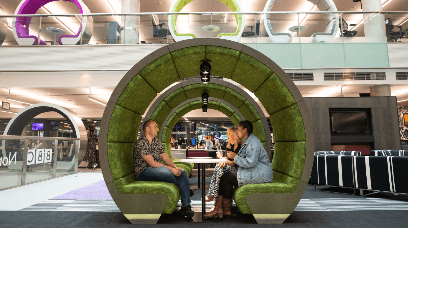 BBC employees in a meeting pod