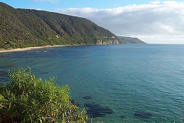 The Great Ocean Road winds along the coastline of Victoria, offering spectacular views of the Bass Strait and Southern Ocean