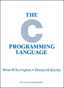 Book cover for "The C Programming Language", first edition, featuring text in light blue serif capital letters on white background and very large light blue sans-serif letter C.