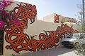 Art installation, Rue Djerba, Er Ryadh quarter, Tunisia, by el Seed, the calligraffiti artist