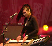 Shneider performing with Queens of the Stone Age, 2005