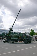 On display, side profile of deployed howitzer