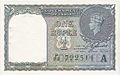 A Government of India 1940-es szériájú 1 rúpiás államjegye, a háborúra való tekintettel, az 1 rúpiás ezüstérmék kiváltására bocsátották ki. A jobb sarokban egy VI. György ezüstrúpia ábrázolása látható.