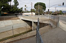 Intersection of two streets under which is a flood-control channel