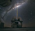 Image 19 Adaptive optics Photo: Yuri Beletsky, ESO A laser shoots towards the centre of the Milky Way from the Very Large Telescope facility in Chile, to provide a laser guide star, a reference point in the sky for the telescope's adaptive optics (AO) system. AO technology improves the performance of optical systems by reducing the effect of atmospheric distortion. AO was first envisioned by Horace W. Babcock in 1953, but did not come into common usage until advances in computer technology during the 1990s made the technique practical. More selected pictures