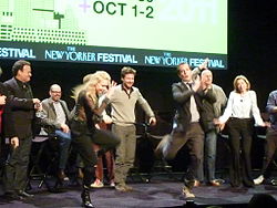 Actors from Arrested Development dancing on a stage
