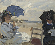 La plage de Trouville, 1870, National Gallery, London. The left figure may be Camille, on the right possibly the wife of Eugène Boudin, whose beach scenes influenced Monet.[35]