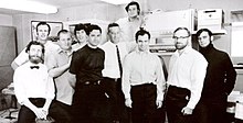Ten computer engineers pose for a 1969 black-and-white photo
