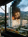 Image 15Executive council building burns in Sarajevo after being hit by Bosnian Serb artillery in the Bosnian War. (from 1990s)