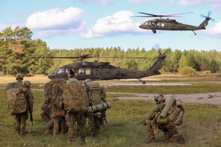 U.S. Army UH-60 Black Hawk helicopters assigned to 2nd General Support Aviation Battalion, 227th Aviation Regiment, 1st Air Cavalry Brigade, 1st Cavalry Division, approach a landing zone during Exercise Paladin Shield at Camp Adazi, Latvia, Sept....