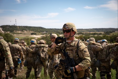 U.S. Army Capt. Joe Kaufman, 2nd Battalion, 162nd Infantry Regiment, Oregon Army National Guard, communicates radio commands during a Culminating Training Event within a Military Operations in Urban Terrain site at Fort Cavazos, Texas, Sept. 14,...