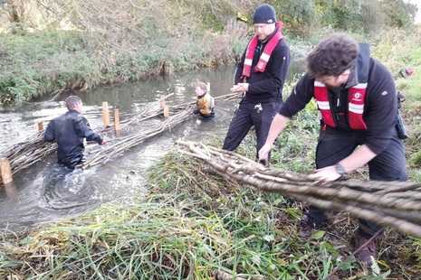 Officers doing work as part of the Fisheries Improvement Programme