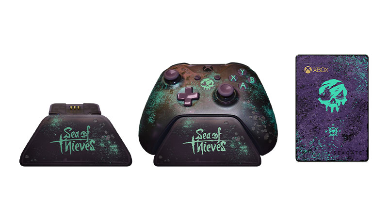 Controller stand, controller on stand and Seagate external hard drive all designed with Sea of Thieves coloring and logos.