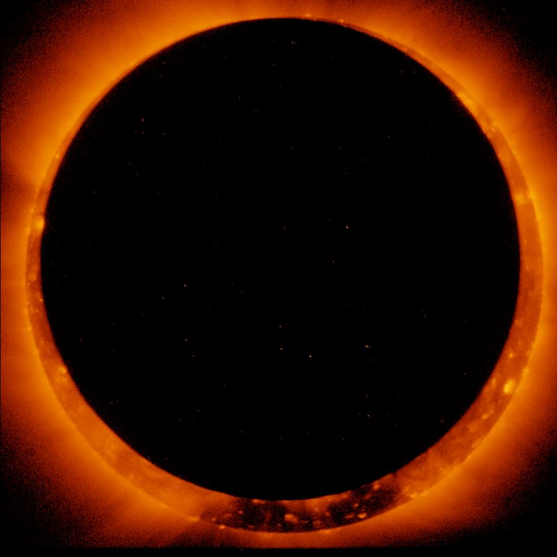A black circle is in the middle with a bright orange glow around it shows the 2022 annular solar eclipse.