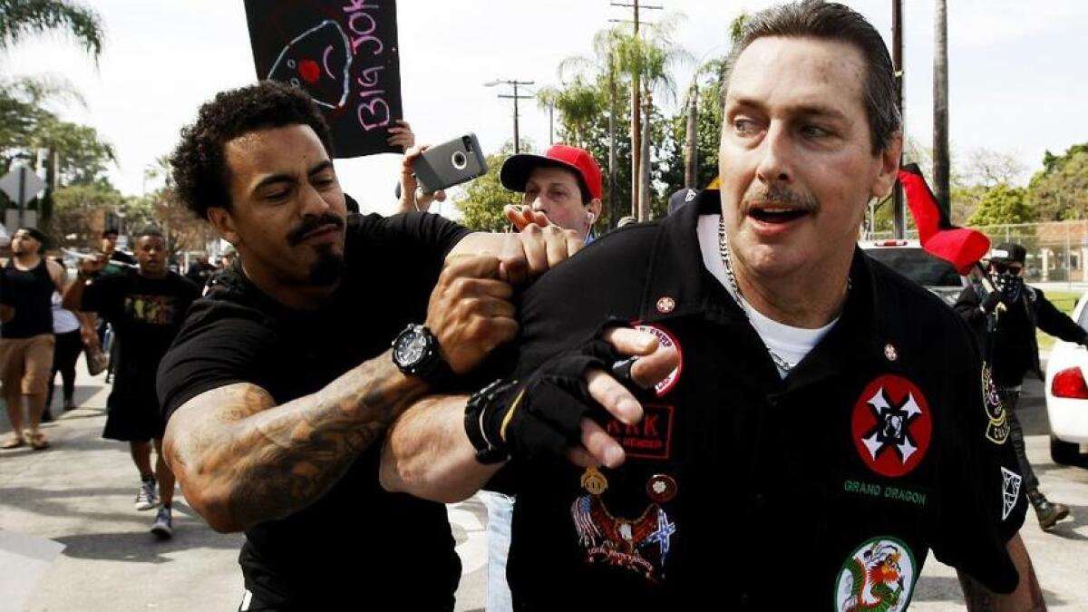 William Hagen, right, shown at a Ku Klux Klan rally in Anaheim, is a high-ranking Klansman based in California.