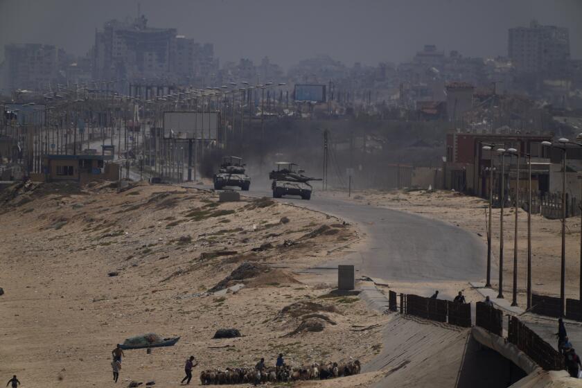 Israeli army tanks are seen in the central Gaza Strip, Saturday, May 18, 2024. (AP Photo/Abdel Kareem Hana)