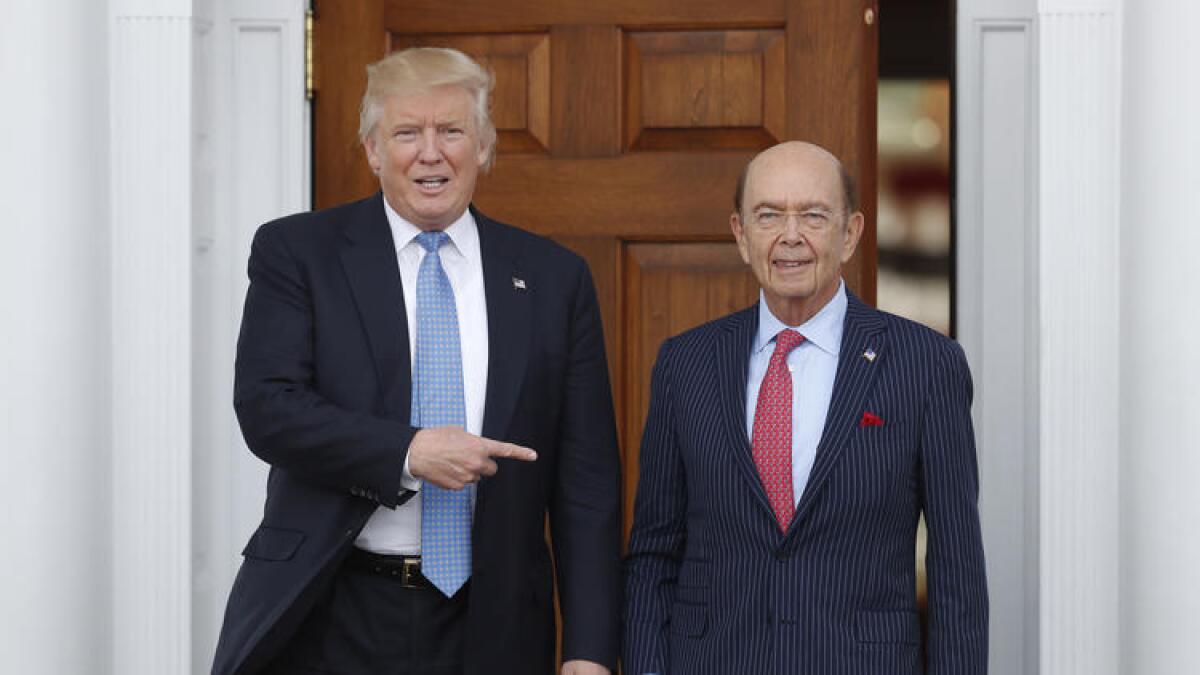 President-elect Donald Trump, left, with investor Wilbur Ross, whose estimated worth is $2.5 billion.