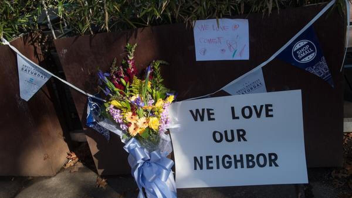 Flowers and messages at the front of a Washington pizzeria targeted Sunday by an armed man.
