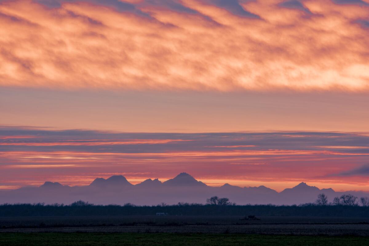 The sun sets over the Sutter Buttes.