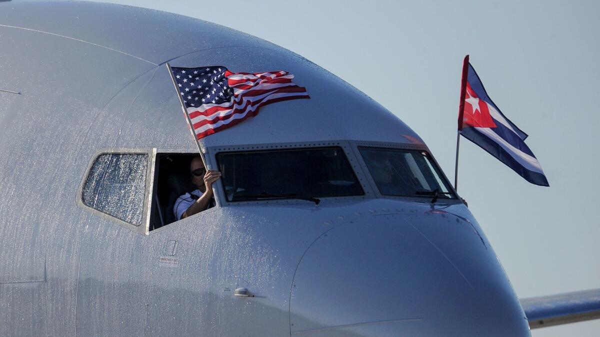 An American Airlines jet with U.S. and Cuba flags arrives in Havana.