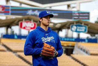 Los Angeles, CA - March 25: Shohei Ohtani does some pitching practice after he addreses allegations.