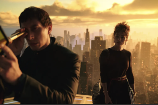 A man and woman stand on a rooftop.