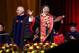 LOS ANGELES-CA-MAY 10, 2024: USC valedictorian Asna Tabassum receives her diploma on stage beside Dean of the USC Viterbi School of Engineering Yannis C. Yortsos at the Galen Center in Los Angeles on May 10, 2024. (Christina House / Los Angeles Times)