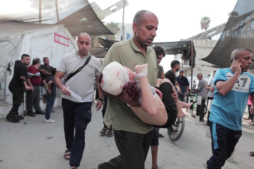 GAZA CITY, GAZA - SEPTEMBER 21: (EDITORS NOTE: Image depicts graphic content) Injured Palestinians, including children, are brought to al-Ahli Baptist Hospital for treatment after Israeli attack on a market on al-Telatini street in Gaza City, Gaza on September 20, 2024. (Photo by Momen Faiz/Anadolu via Getty Images)