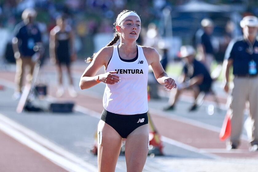 Ventura's Sadie Engelhardt crosses the finish line to win the girls' 1,600-meter title.