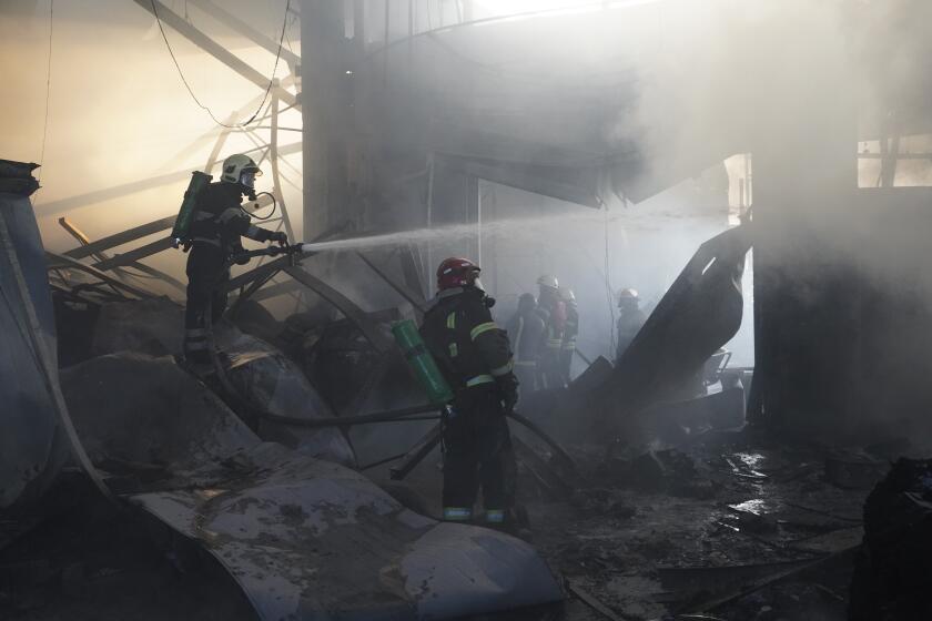 Firefighters put out a fire after Russian attack in Kharkiv, Ukraine, Saturday, May, 25, 2024. (AP Photo/Andrii Marienko)